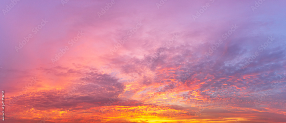 panorama background of sky covered with multicolored clouds from the morning sunlight