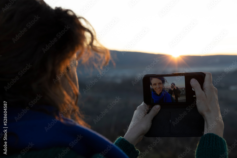 Woman Taking a Selfie with Her Boyfriend in the Composition Making a Photograph of Her taking a Selfy