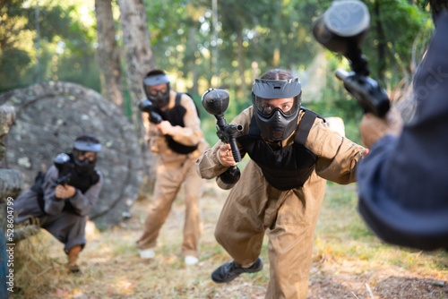 Attack of the paintball team on the enemy at the army training ground