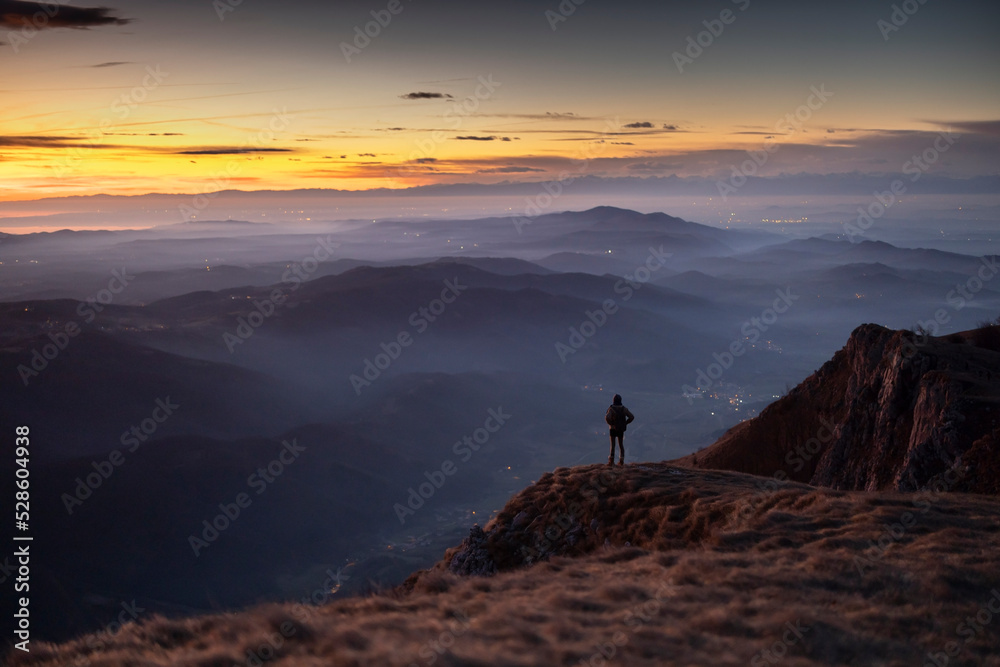Hiker looking at beautiful View of Vipava Valley in Slovenia At Dusk Colours