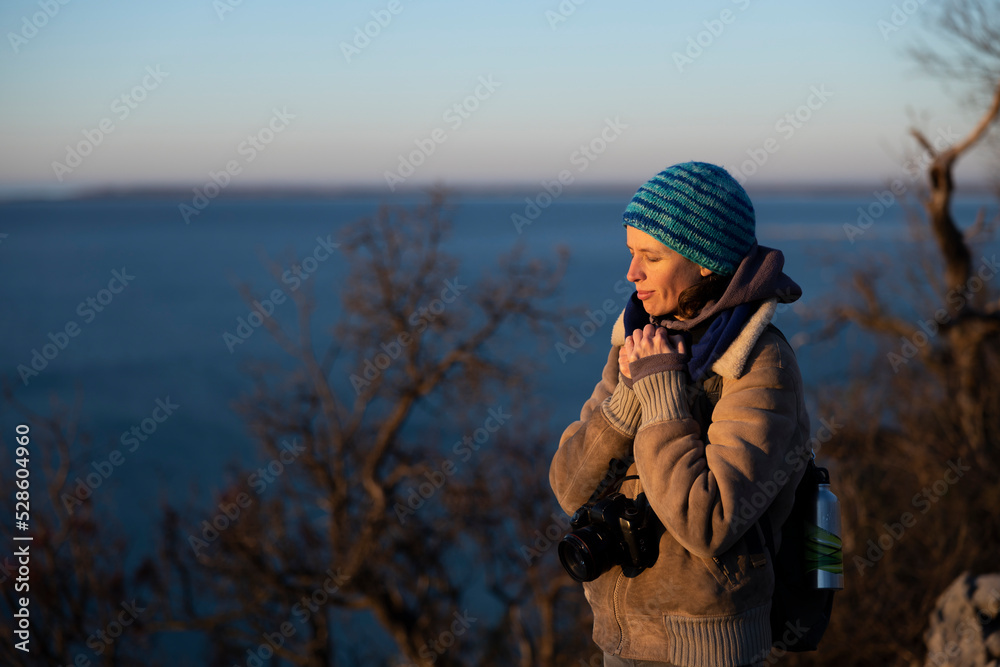 Cold Winter morning for a Female Photographer Waiting for a Sunrise on Sea Photograph