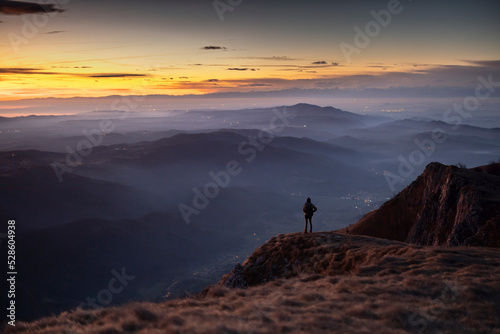 Hiker looking at beautiful View of Vipava Valley in Slovenia At Dusk Colours