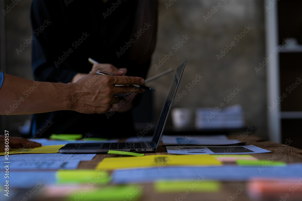 business team brainstorming Close-up group of people chatting with papers on the table. initial concept joint business business team brainstorming Close-up group of people chatting with papers on the table. initial concept joint business
