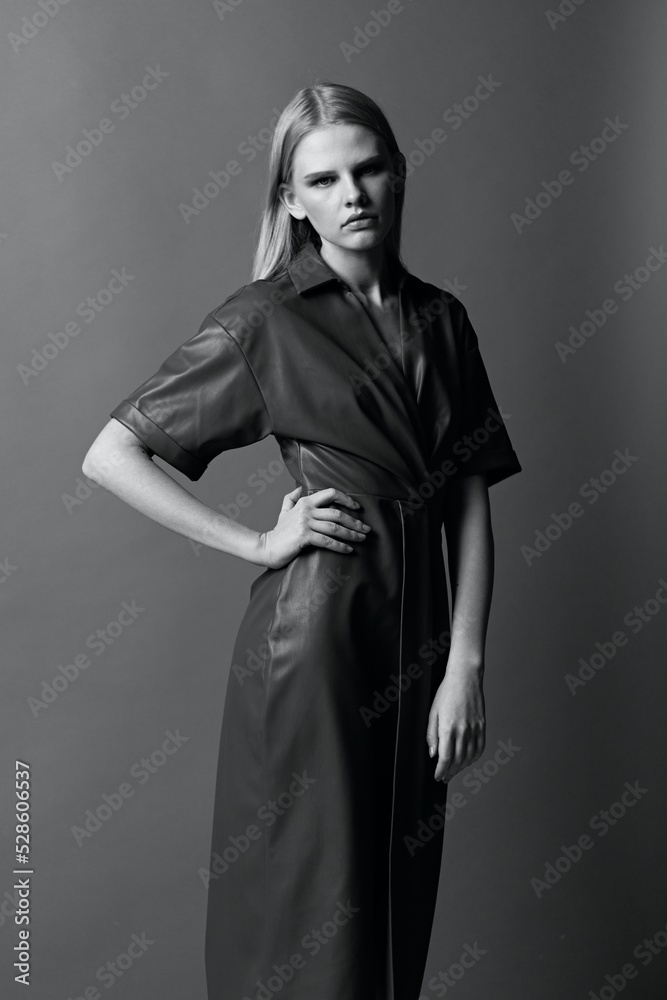 Black and White fashion concept. Beautiful seriously blonde woman posing at studio. Stylish offer for brand design banner. Black and White fashion concept. Beautiful seriously blonde woman posing at studio. Stylish offer for brand design banner.
