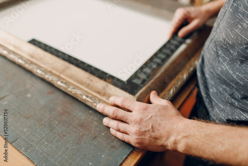 Framing Workshop. Measure ruler frame baguette handmade picture frame at studio table