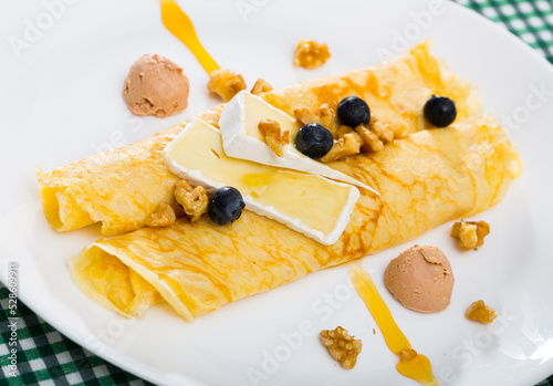 Pancakes with cheese Brie, blueberry and fuagra. High quality photo photo