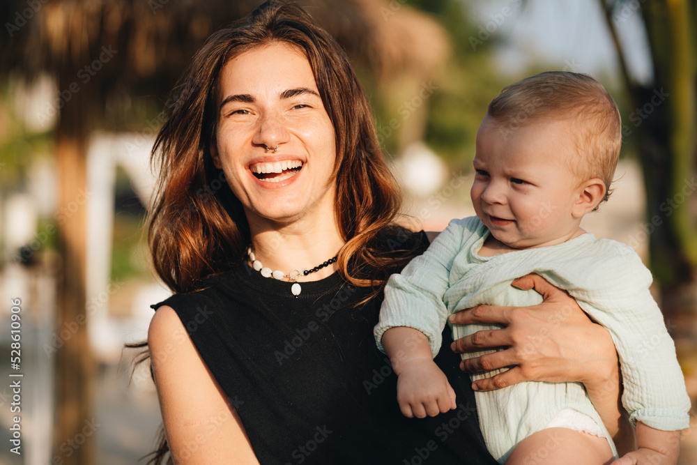 Fototapeta premium Grandmother with her grandson toddler outdoors
