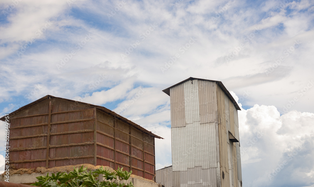 SILO, BARN OF A CORN AND RICE PROCESSOR BUILT FROM ZINC SHEETS