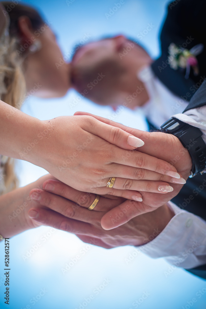 bride and groom holding hands