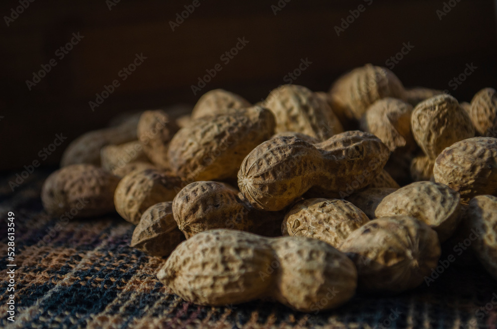 Peanuts on dark background. Healthy food. Peanuts on dark background. Healthy food.