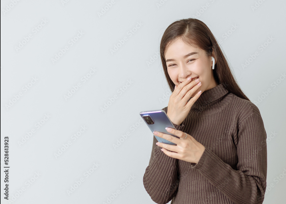 smilly woman typing on touching screen phone cellphone,technology concept,shopping online,social network smilly woman typing on touching screen phone cellphone,technology concept,shopping online,social network