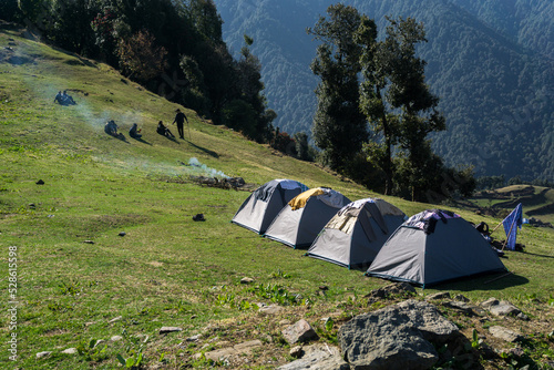 March 13th 2021 Uttarakhand India. Camps in line at the Nag Tibba mountain trekking region. Himalayan region. photo