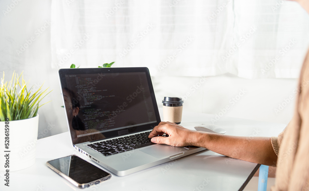 Programmer woman writing program HTML code sitting at workplace in office, IT software developer hands typing data coding programming with laptop computer, IT start up concept, Web application design Programmer woman writing program HTML code sitting at workplace in office, IT software developer hands typing data coding programming with laptop computer, IT start up concept, Web application design