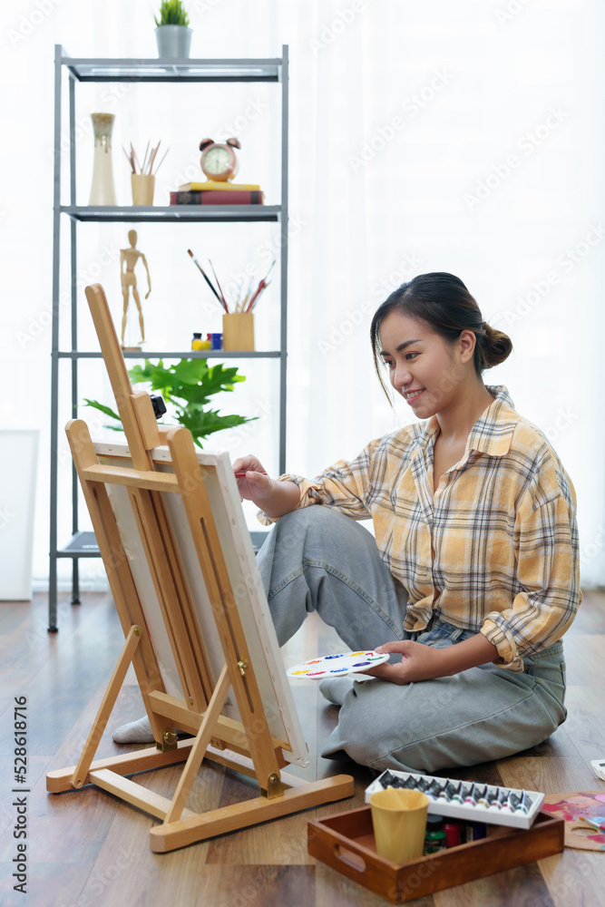 Portrait of an Asian woman designing art in her spare time.