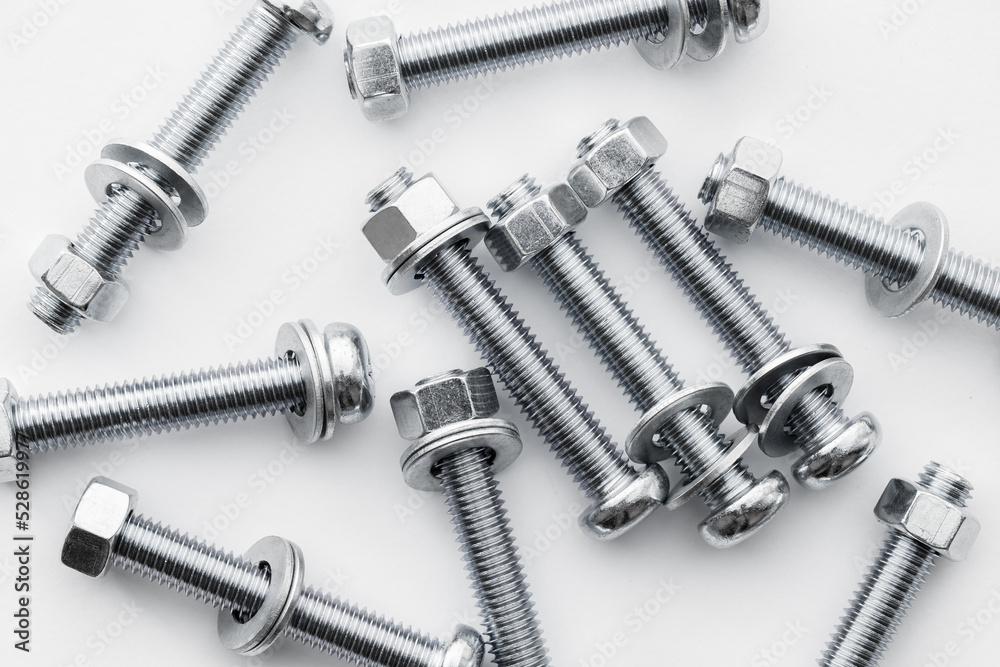 Nuts and bolts closeup on white background Nuts and bolts closeup on white background