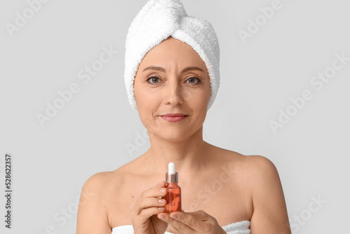 Mature woman with cosmetic ...