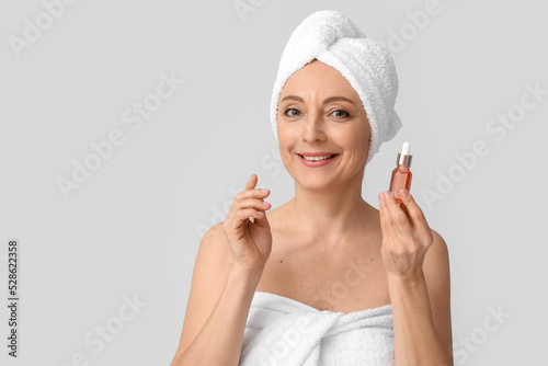 Mature woman with cosmetic ...