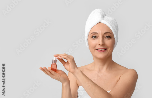 Mature woman with cosmetic ...