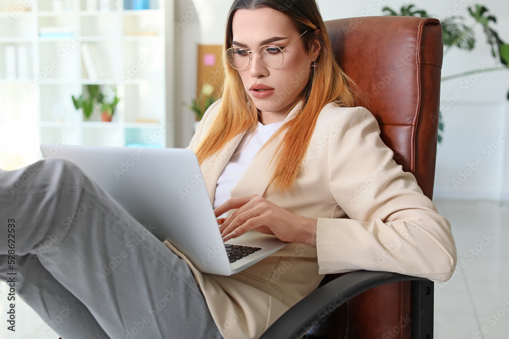 Transgender programmer working in office Transgender programmer working in office
