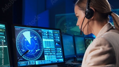 Workplace of the air traffic controllers in the control tower. Team of professional aircraft control officers works using radar, computer navigation and digital maps. Aviation concept. photo