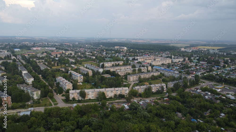 Aerial photography. Top view of a provincial town. Area with multi-storey buildings.