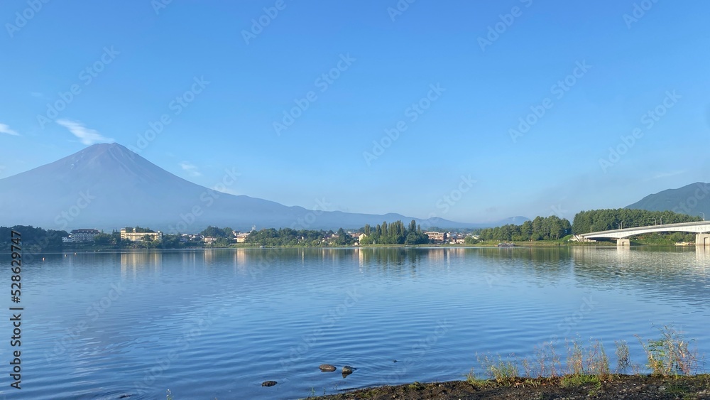 Mt. Fuji with the lake shore and the bushes, Kawaguchiko lakeside in Yamanashi prefecture of Japan, year 2022 August 27th