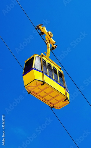 Yellow Сable Funicular Car and Blue Sky. Vertical Photo photo