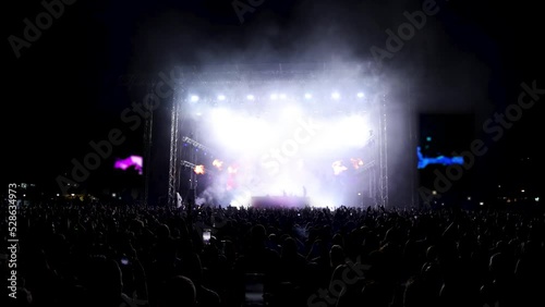 Full view of concert pyrotechnic extravaganza - lasers, strobes, LED, and flames photo