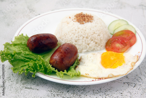 Freshly cooked Filipino food called Longsilog photo
