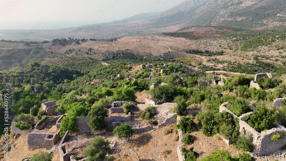 Abandoned and remains of a village on the top of a mountain during sunset drone 4K Abandoned and remains of a village on the top of a mountain during sunset drone 4K