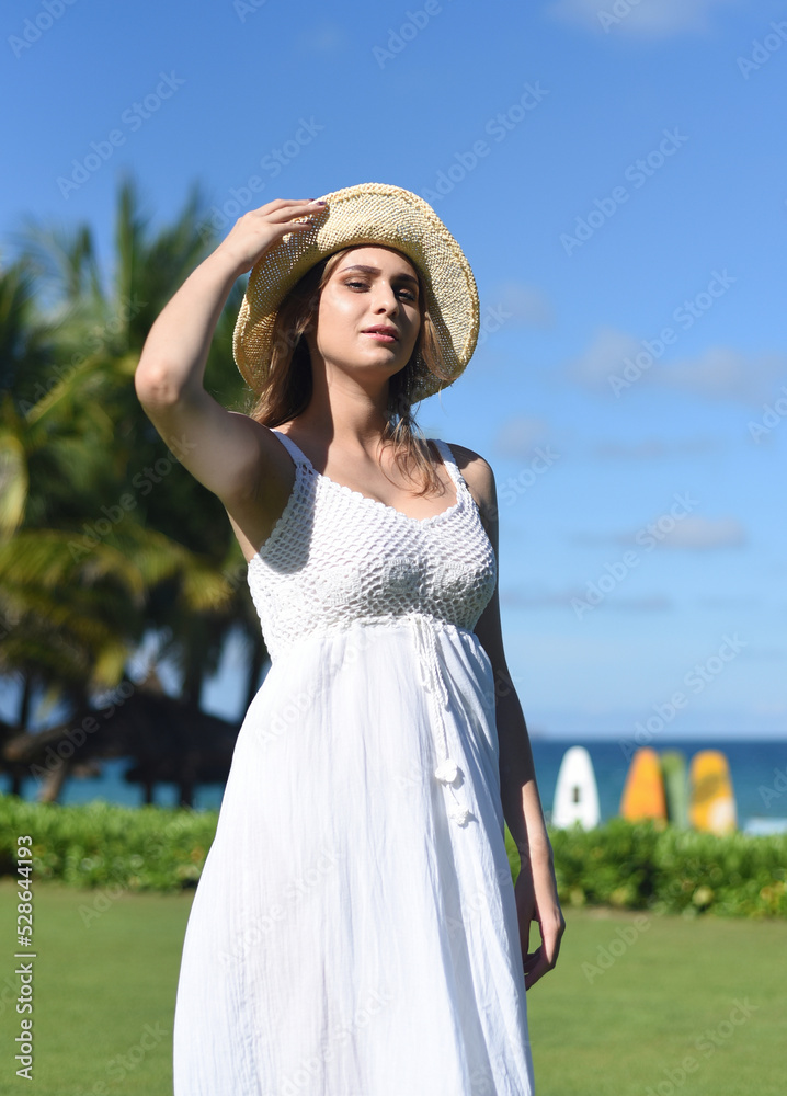 Portrait of beautiful Belarus woman half Ukrainian in white dress and hat