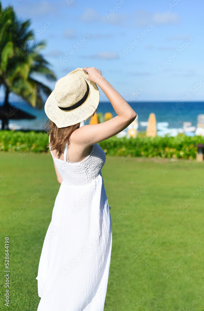 Fototapeta premium Portrait of beautiful Belarus woman half Ukrainian in white dress and hat