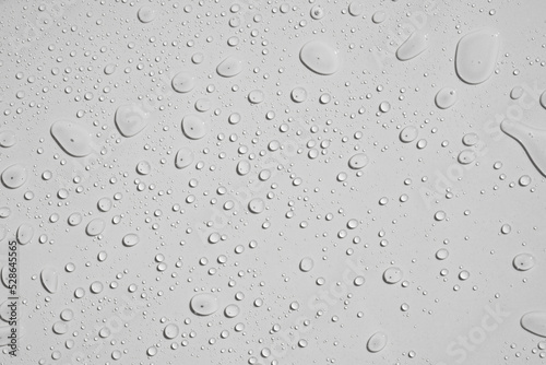 Water droplets on white tile