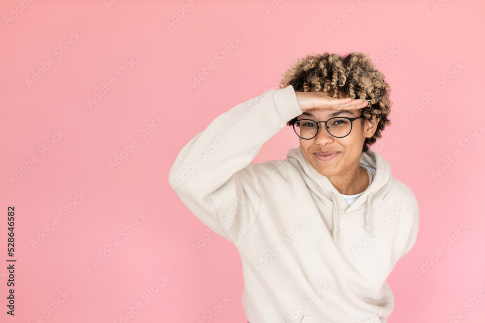 Smiley African American woman in studio. Female model with curly hair fooling around, smiling. Portrait, emotion concept Smiley African American woman in studio. Female model with curly hair fooling around, smiling. Portrait, emotion concept