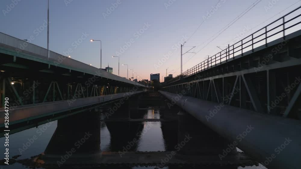 Flight through the middle of the Gdansk Bridge with a view of the modern panorama of Warsaw during sunset. Flight through the middle of the Gdansk Bridge with a view of the modern panorama of Warsaw during sunset.