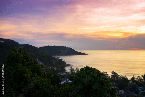 Seascape view from the high on sea horizon and coastline at beautiful sunset on Phuket Island in Thailand © evgenydrablenkov