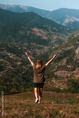 Travel. Girl travels through the mountains glamping, tents,waterfalls of wild nature. Unity, mental health, eco travel. Hiking in the mountains, van life vibes, travelling,good moments, digital detox