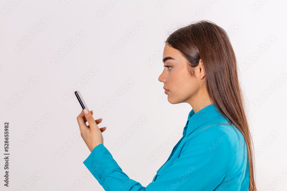 Biometric identification. Young beautiful woman scanning face with facial recognition system on smartphone. Biometric identification. Young beautiful woman scanning face with facial recognition system on smartphone.