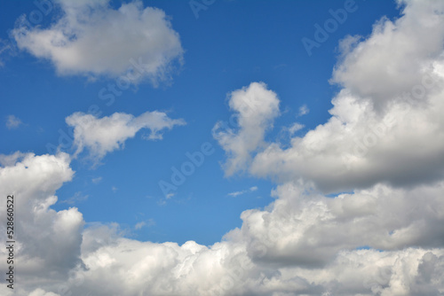 White  fluffy clouds in blue sky. Background from clouds.