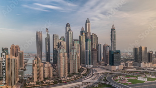 Skyscrapers of Dubai Marina near Sheikh Zayed Road with highest residential buildings morning timelapse © neiezhmakov