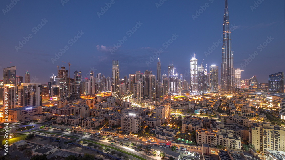 Obraz premium Dubai Downtown night to day timelapse with tallest skyscraper and other towers