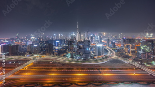 Fotografie Panoramic skyline of Dubai with business bay and downtown district all night timelapse