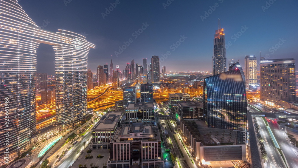 Obraz premium Futuristic Dubai Downtown and finansial district skyline aerial night to day timelapse.