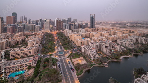 Photography Skyscrapers in Barsha Heights district and low rise buildings in Greens district aerial day to night timelapse