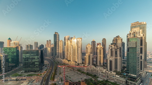 Bay Avenue during sunrise with modern towers in Business Bay aerial panoramic timelapse, Dubai © neiezhmakov