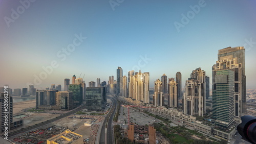 Panorama of Bay Avenue with modern towers residential development in Business Bay aerial all day timelapse