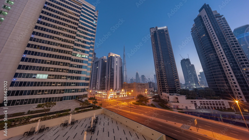 Aerial panoramic looking up view to Dubai downtown and difc skyscrapers night to day timelapse. Aerial panoramic looking up view to Dubai downtown and difc skyscrapers night to day timelapse.