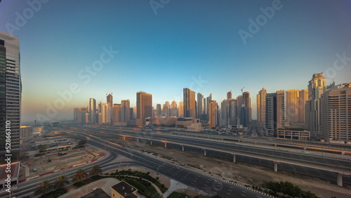 Dubai Marina skyscrapers and Sheikh Zayed road with metro railway aerial timelapse  United Arab Emirates