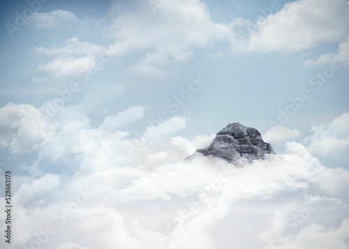 Mountain peak through the clouds
