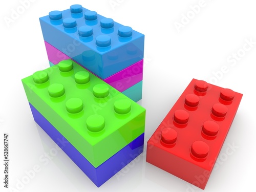 Red toy block outside the construction of colored toy blocks
